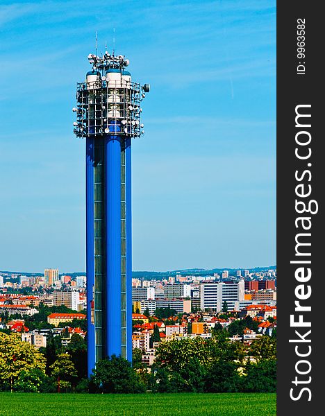 Water tower in Prague, Czech republic with a city skyline in the background