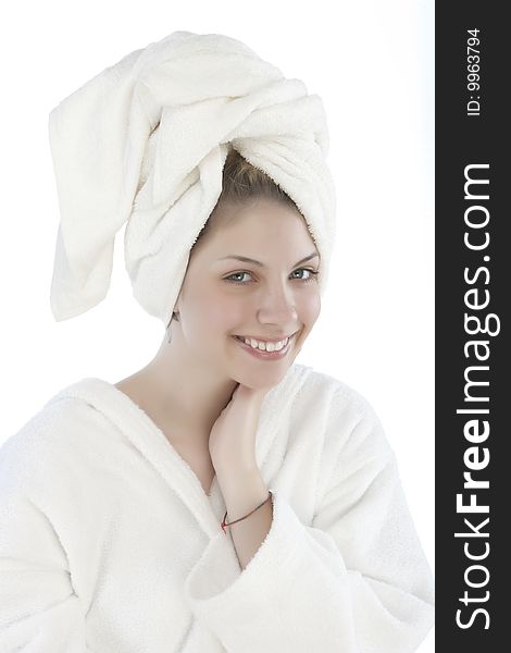 Beautiful woman with a white towel on her head isolated on white background. Beautiful woman with a white towel on her head isolated on white background