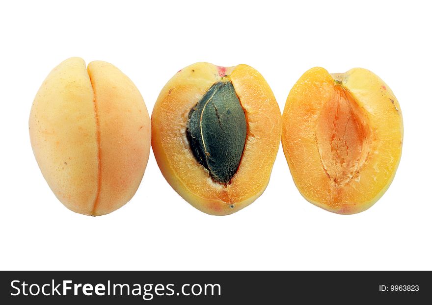 Three apricots on the white background
