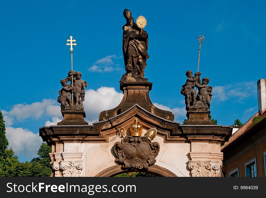 Monastery gate with sculpture of saint norbert in prague, czech republic