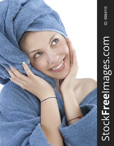 Young woman dressed blue bathrobe and towel