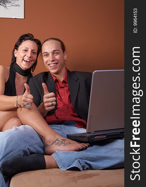 Thumbs-up from young couple