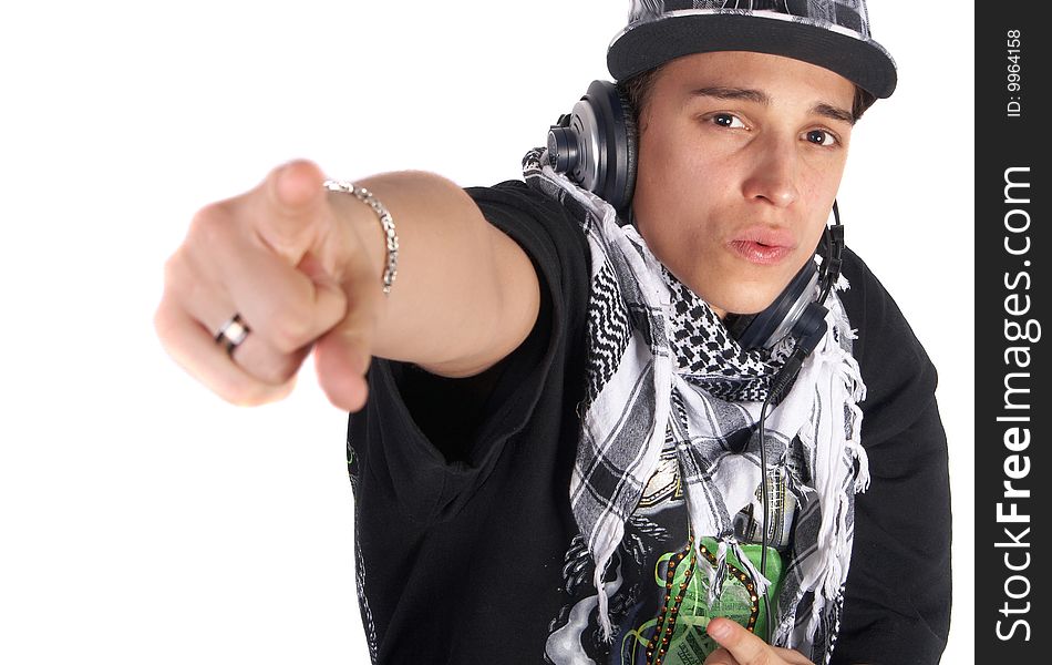 A young DJ is pointing up. He is listening to music on his headphones! Focus is on his face. Isolated over white. A young DJ is pointing up. He is listening to music on his headphones! Focus is on his face. Isolated over white.