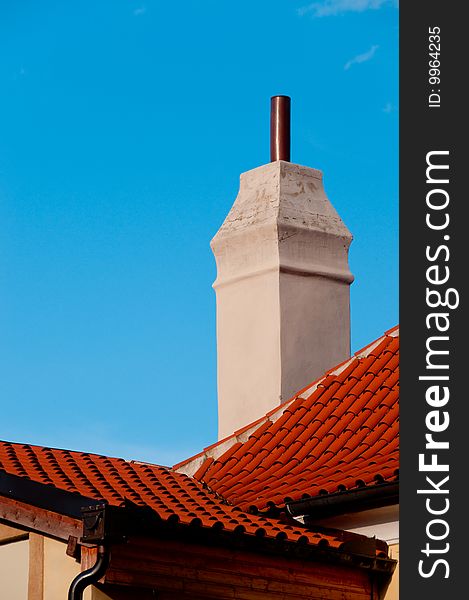 Closeup Of Red Roof With Chimney