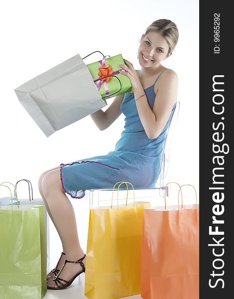Portrait of an attractive young woman holding several shoppingbags.