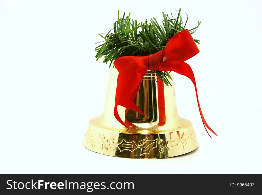 Bell with a red bow and the tree on a white background