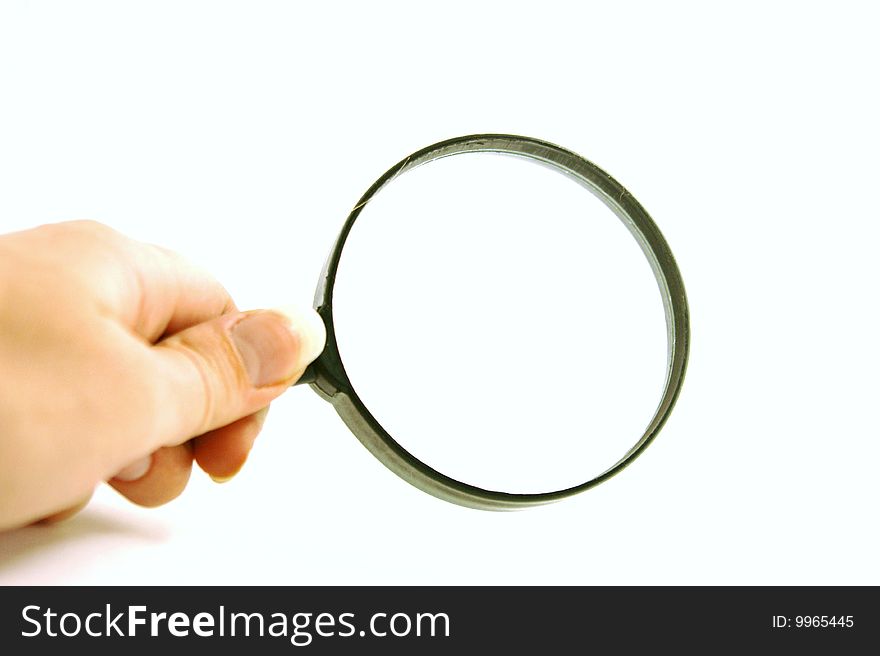 Magnifying glass on a white background, taken close-up,. Magnifying glass on a white background, taken close-up,
