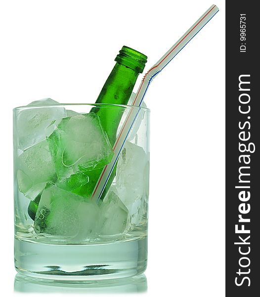 Cocktail: glass with ice and green bottle. Cocktail: glass with ice and green bottle