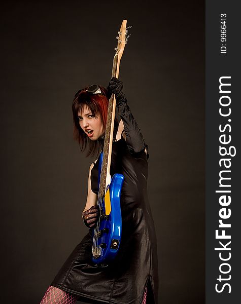 Screaming rock girl with bass guitar. Screaming rock girl with bass guitar