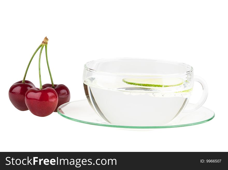 Cup of water with lemon and cherries, isolated on white background