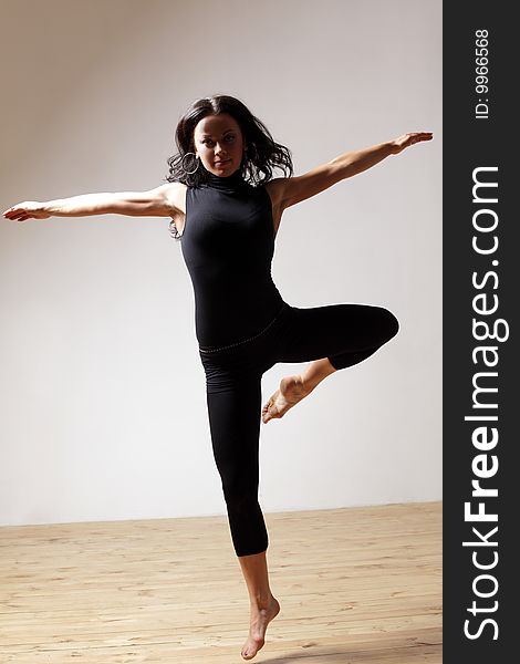 Modern style dancer posing on studio background. Modern style dancer posing on studio background