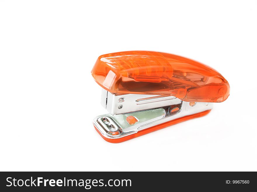 Orange stapler isolated on a white background with room for text.