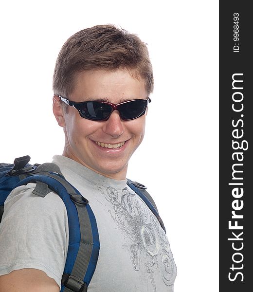 Young man with a rucksack and sun glasses. Young man with a rucksack and sun glasses