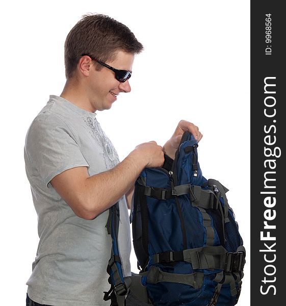 Young man with a rucksack and sun glasses. Young man with a rucksack and sun glasses