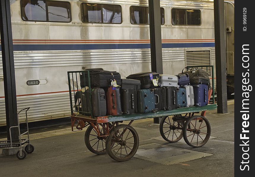 Baggage load on a dolly at the train station platform. Baggage load on a dolly at the train station platform.