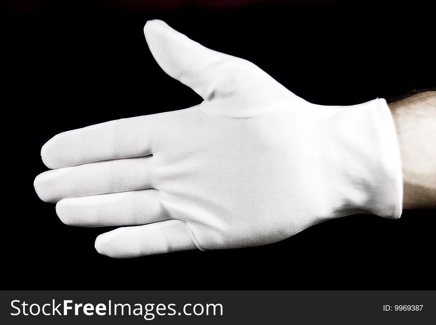 Handshake with a white cotton glove