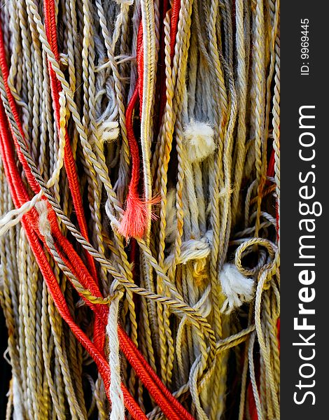 Tangled colorful ropes macro background. Tangled colorful ropes macro background