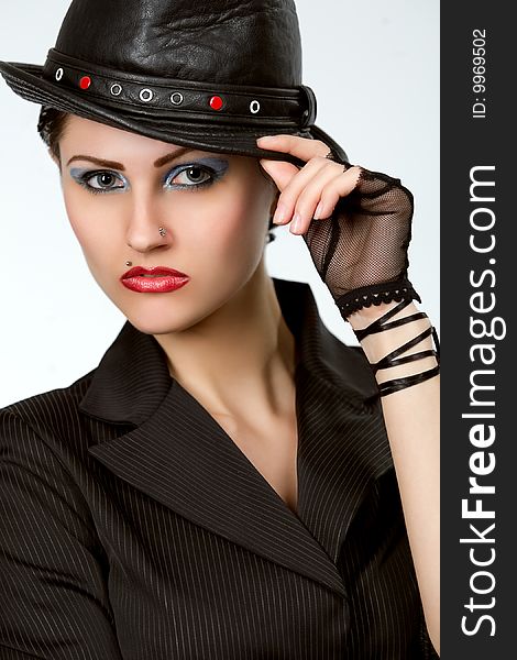 Young fashionable woman with black hat. Young fashionable woman with black hat