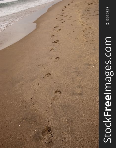 A trail left behind by a barefoot runner. A trail left behind by a barefoot runner