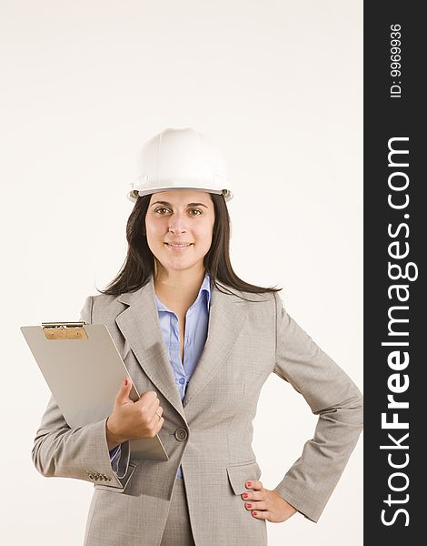 Professional woman with clipboard and hard hat. Professional woman with clipboard and hard hat