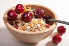 Muesli With Cherry In Wooden Bowl Royalty Free Stock Images