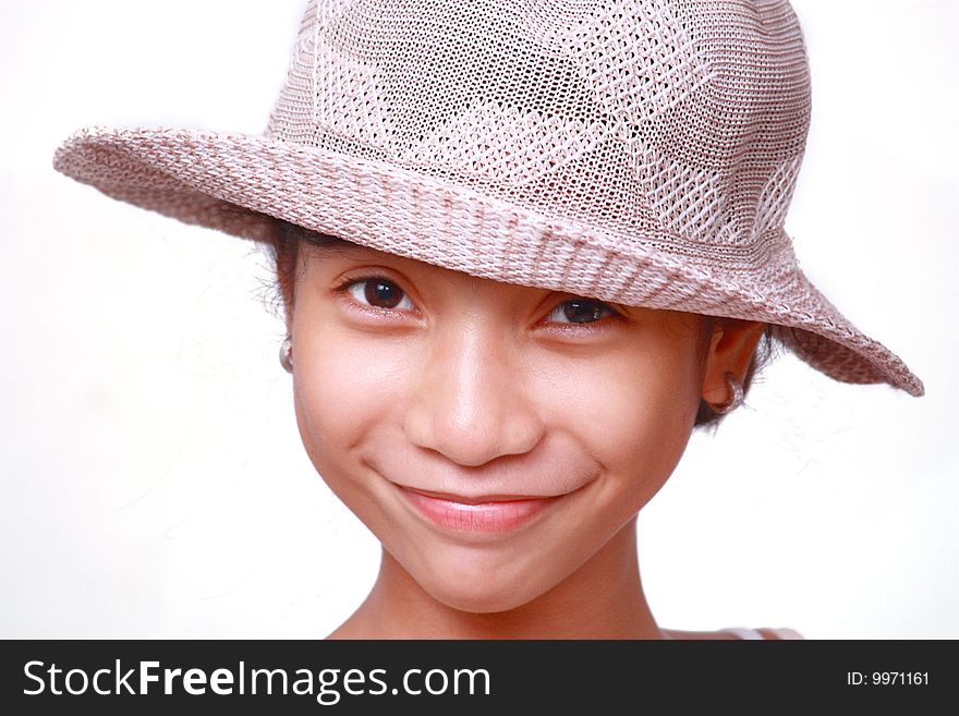 Smiling asian girl wearing a hat isolated in white background. Smiling asian girl wearing a hat isolated in white background