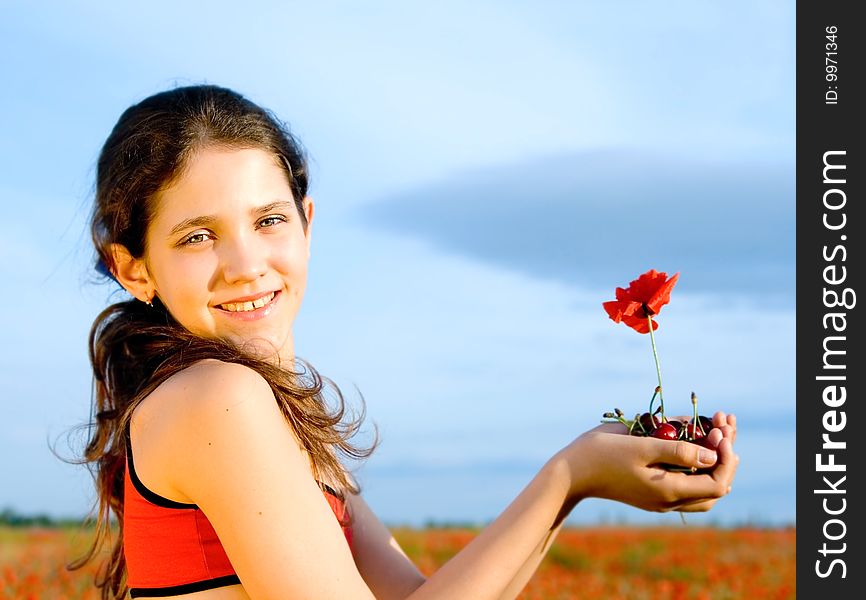 Portrait teen girl with poppy on nature