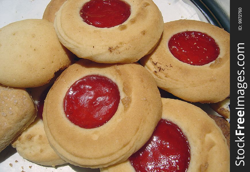 Close up view of some butter cookies with strawberry jam in the middle