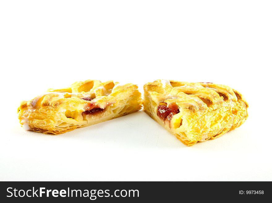 Raspberry and custard danish cut in half with clipping path on a white background. Raspberry and custard danish cut in half with clipping path on a white background