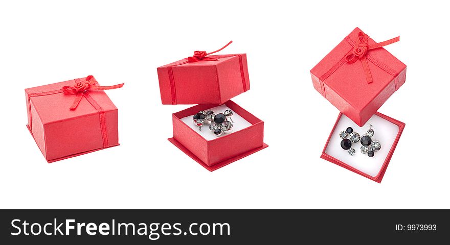 Earring in red present box isolated on white. Earring in red present box isolated on white
