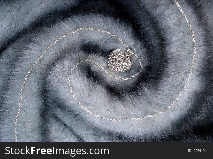 Elegant chain with diamond heart on fur. Elegant chain with diamond heart on fur