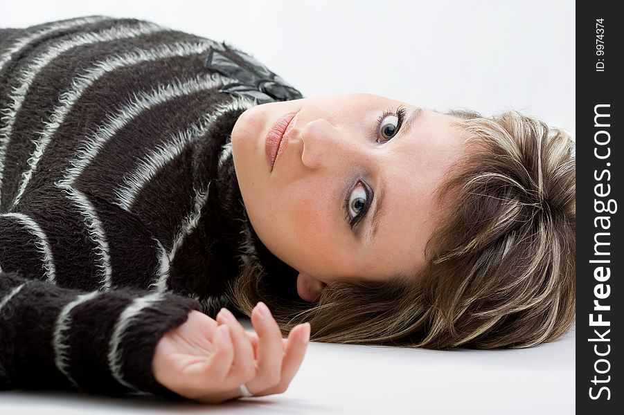 brunette model lying on white background. brunette model lying on white background