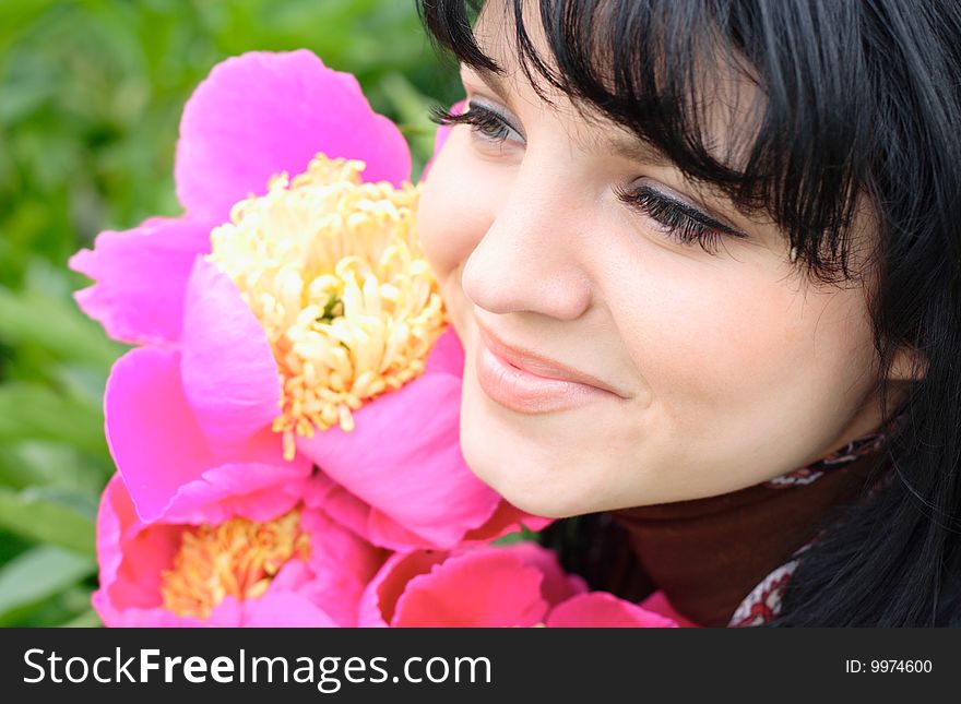 Portrait of the young nice girl with a flower. Portrait of the young nice girl with a flower