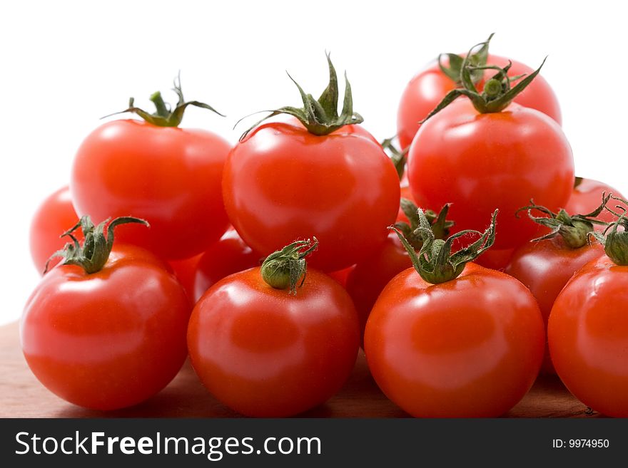 Ripe tomatoes isolated over white