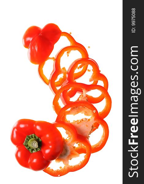 Slices of pepper on a withe isolated background with copy space. Slices of pepper on a withe isolated background with copy space