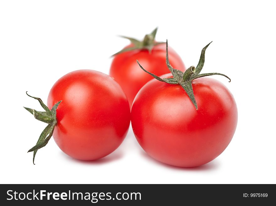 Ripe tomatoes isolated over white
