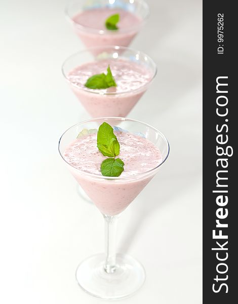 Smoothie made with strawberries decorated with mint. Smoothie made with strawberries decorated with mint