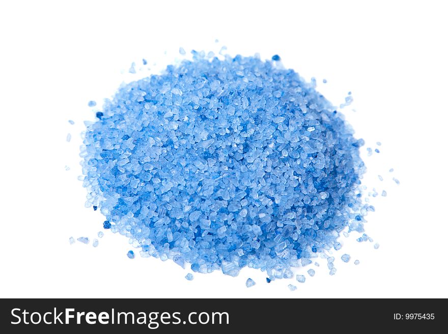 Heap of blue herbal salt isolated over white