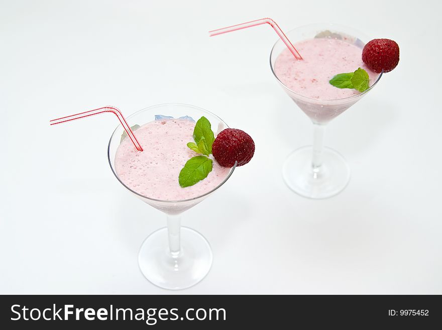 Strawberry smoothie decorated with mint and strawberry