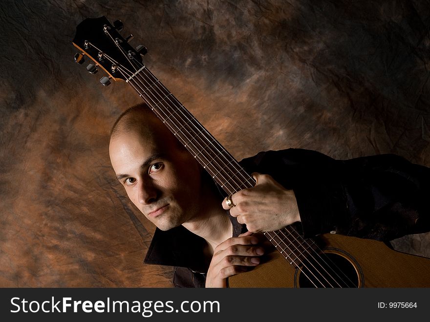 Musician playing guitar. man with acoustic guitar