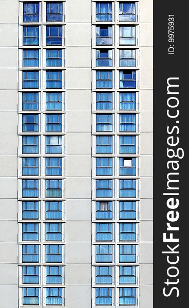Modern building facade with two lines of blue windows. Modern building facade with two lines of blue windows