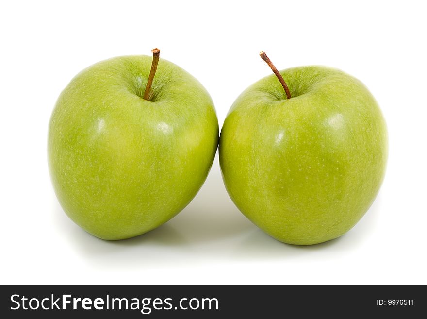 Two green apples on a white background