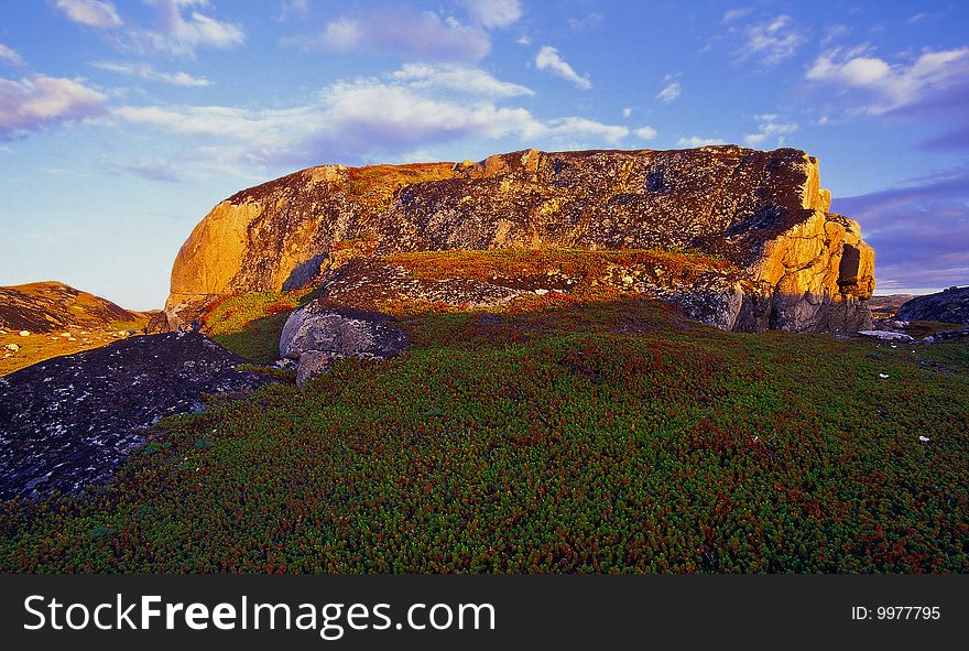 Lonely rock on a long sunny polar summer day