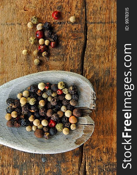 Colorful Peppercorns On A Wooden Spoon