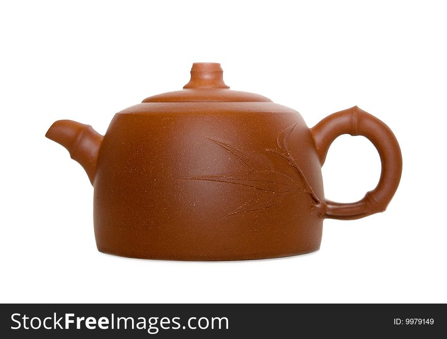Close-up photo of brown teapot isolated over white background