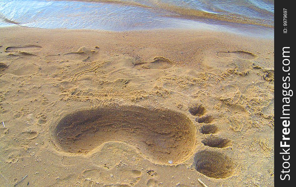 Trace of very big foot on the sand. Trace of very big foot on the sand