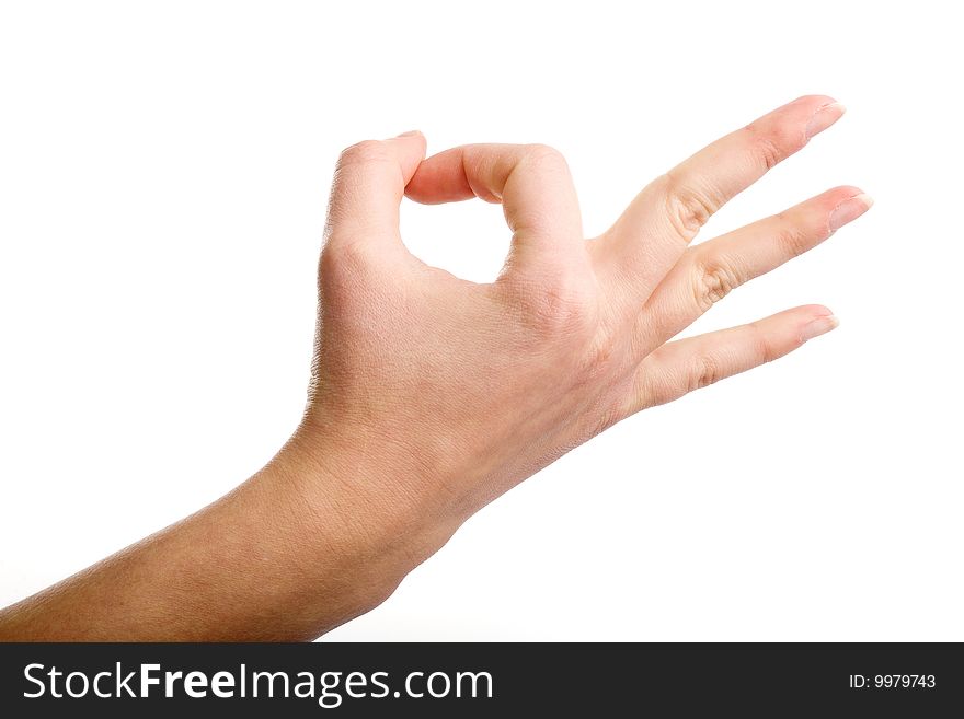 Female hand demonstrating OK gesture on the white background. Female hand demonstrating OK gesture on the white background