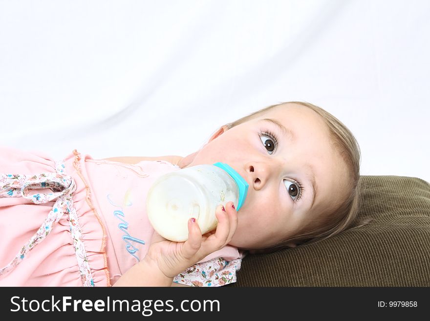 Little baby eating milk isolated