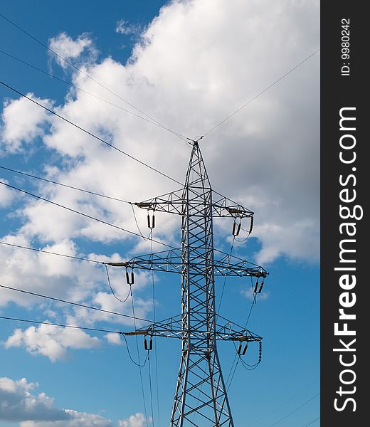 High-voltage line on the cloudy sky background. High-voltage line on the cloudy sky background