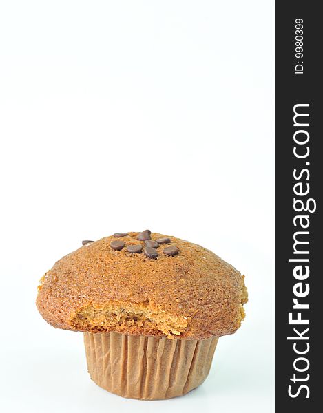 An image of an isolated chocolate chip muffin on a white background. An image of an isolated chocolate chip muffin on a white background.